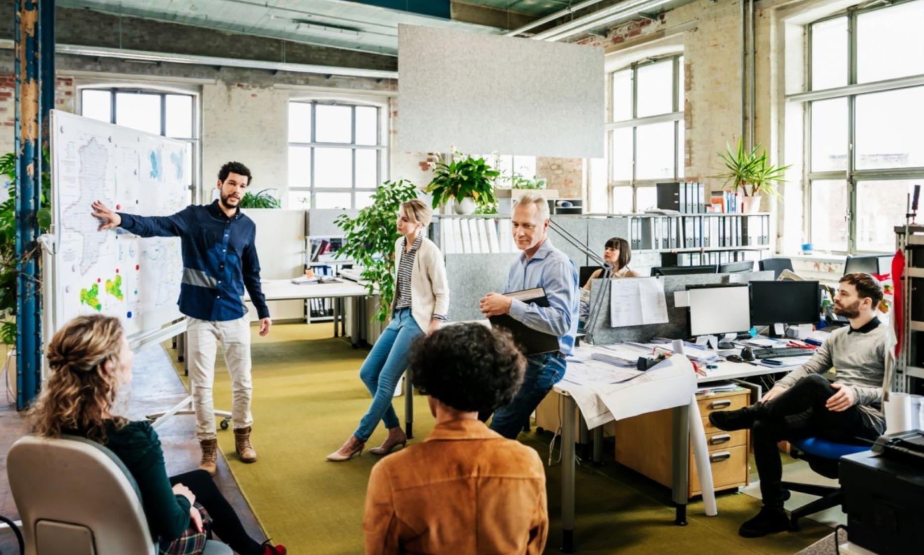 Financial team engaged in collaborative discussion reviewing documents