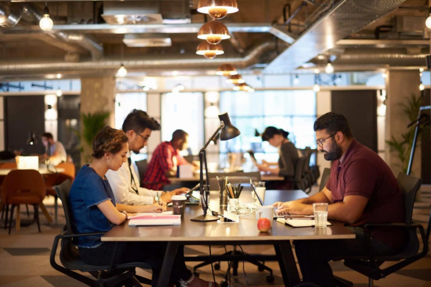 Professional presenting financial data to engaged audience in conference setting